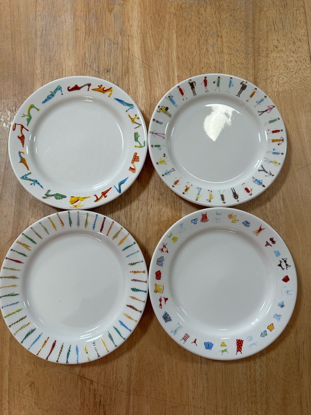 Cynthia Rowley White Ceramic Dinner Plates with Multicolor Rim Motifs